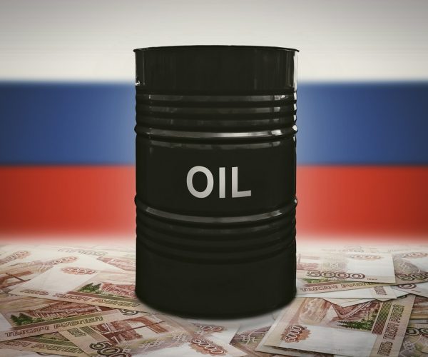 A barrel of oil on the background of the Russian flag and rubles. (Photo:© Dmitrii Melnikov/Dreamstime.com)